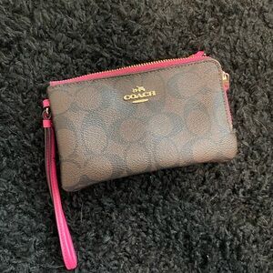 COACH brown and pink leather wallet.
